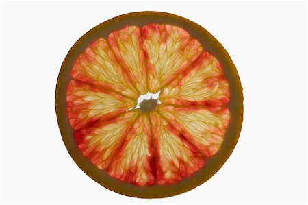 Slice of grapefruit, backlit Stock Photo - Premium Royalty-Free, Code: 659-01845569