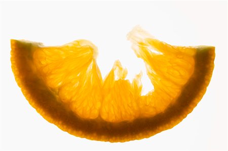 Half a slice of orange, backlit Stock Photo - Premium Royalty-Free, Code: 659-01845605