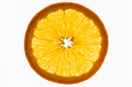 Slice of orange, backlit Stock Photo - Premium Royalty-Free, Code: 659-01845606