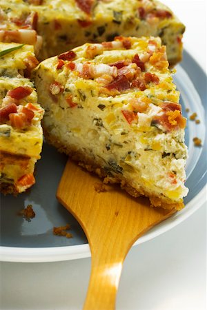 simsearch:659-01866087,k - Leek and bacon quiche, a piece cut, with piece on server Stock Photo - Premium Royalty-Free, Code: 659-01845638