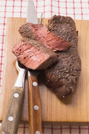 pan fried fillet of beef - Beef steaks, partly sliced Stock Photo - Premium Royalty-Free, Code: 659-01845783