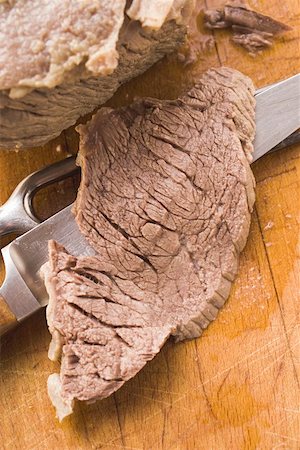 Boiled beef with a slice carved Stock Photo - Premium Royalty-Free, Code: 659-01845794