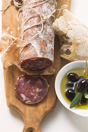 simsearch:659-06902104,k - Italian salami, olives in olive oil, white bread Stock Photo - Premium Royalty-Free, Code: 659-01845851