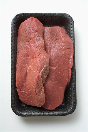 simsearch:659-01843908,k - Two slices of beef sirloin in polystyrene tray Stock Photo - Premium Royalty-Free, Code: 659-01845881