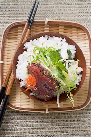 simsearch:851-02961173,k - Raw tuna fillet with poppy seeds, rice and salad Stock Photo - Premium Royalty-Free, Code: 659-01845926