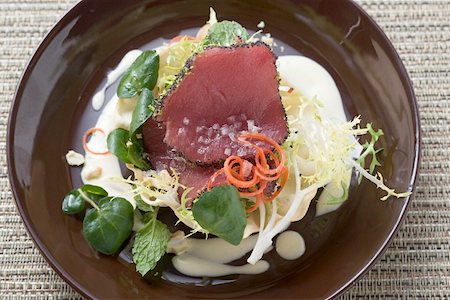 salad tuna - Raw tuna fillets with poppy seeds on salad in bowl Stock Photo - Premium Royalty-Free, Code: 659-01845935