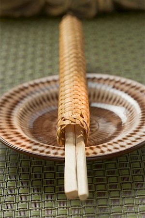 simsearch:659-01846629,k - Chopsticks in woven case on plate Stock Photo - Premium Royalty-Free, Code: 659-01845961