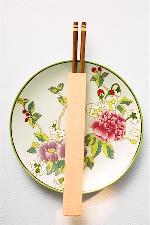 Chinese plate and chopsticks Stock Photo - Premium Royalty-Free, Code: 659-01845971