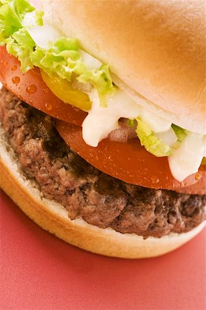 Hamburger with tomato, lettuce and mayonnaise Stock Photo - Premium Royalty-Free, Code: 659-01846055
