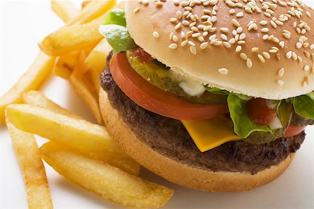 simsearch:659-01847504,k - Cheeseburger and Fries on a Plate Stock Photo - Premium Royalty-Free, Code: 659-01846079