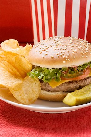 simsearch:659-01847504,k - Cheeseburger with potato crisps and gherkin Stock Photo - Premium Royalty-Free, Code: 659-01846094