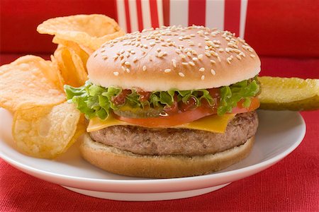 simsearch:659-01847504,k - Cheeseburger with potato crisps and gherkin Stock Photo - Premium Royalty-Free, Code: 659-01846095