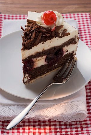 piece of chocolate cake - Piece of Black Forest gateau with cherry Stock Photo - Premium Royalty-Free, Code: 659-01846290