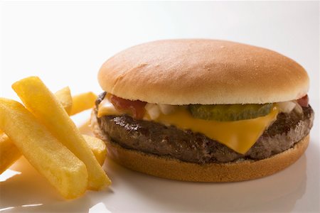 simsearch:659-01847504,k - Cheeseburger and Fries on a Plate Stock Photo - Premium Royalty-Free, Code: 659-01846316