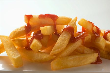 Chips with ketchup Stock Photo - Premium Royalty-Free, Code: 659-01846321