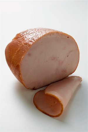 Turkey ham with a slice cut Stock Photo - Premium Royalty-Free, Code: 659-01846348