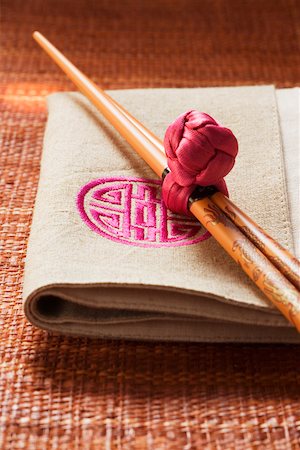 simsearch:659-01846629,k - Chopsticks on fabric napkin (Asia) Stock Photo - Premium Royalty-Free, Code: 659-01846424