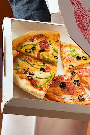 simsearch:659-01847565,k - Pieces of different pizzas in pizza box Stock Photo - Premium Royalty-Free, Code: 659-01846499