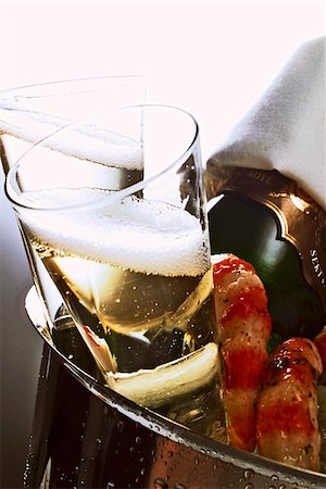 picture of champagne bottle and champagne flute - Two champagne glasses & bottle & shrimps in champagne bucket Stock Photo - Premium Royalty-Free, Code: 659-01846568
