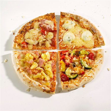 simsearch:659-01859989,k - Quarters of four different pizzas Foto de stock - Sin royalties Premium, Código: 659-01846614