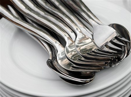 simsearch:659-01846629,k - Pile of plates with spoons and forks Stock Photo - Premium Royalty-Free, Code: 659-01846628