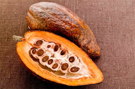 Cacao pod, halved, on brown background Stock Photo - Premium Royalty-Free, Code: 659-01846705