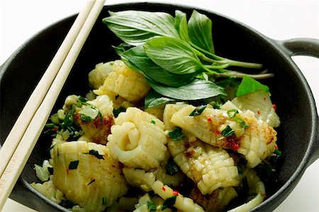 Spicy squid with Thai basil, cooked in the wok Stock Photo - Premium Royalty-Free, Code: 659-01846758