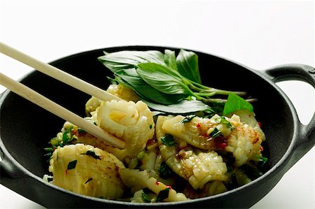 Spicy squid with Thai basil, cooked in the wok Stock Photo - Premium Royalty-Free, Code: 659-01846759