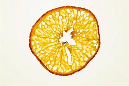 Slice of deep-fried orange, backlit Stock Photo - Premium Royalty-Free, Code: 659-01846834
