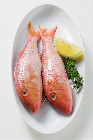 Fresh red mullet with lemon and thyme Stock Photo - Premium Royalty-Free, Code: 659-01846994
