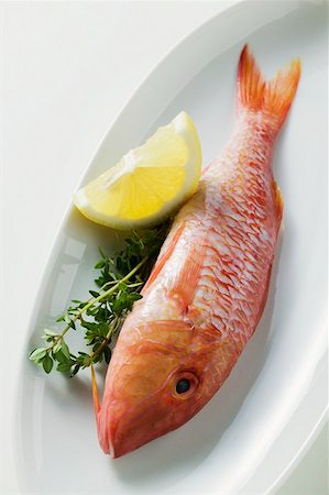 Fresh red mullet with lemon and thyme Stock Photo - Premium Royalty-Free, Code: 659-01846993
