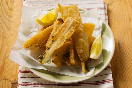 silver beet - Breaded chard stalks with lemon wedges (Liguria) Stock Photo - Premium Royalty-Free, Code: 659-01847123