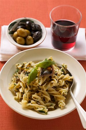 simsearch:659-01861281,k - Fusilli with sardines & basil, olives, glass of red wine Stock Photo - Premium Royalty-Free, Code: 659-01847168