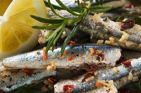 Fried anchovies with dried tomatoes (Calabria) Foto de stock - Sin royalties Premium, Código: 659-01847169