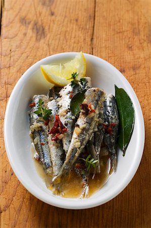 Fried anchovies with dried tomatoes (Calabria) Foto de stock - Sin royalties Premium, Código: 659-01847171