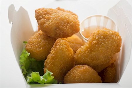 simsearch:659-01847943,k - Chicken Nuggets with sweet and sour sauce to take away Stock Photo - Premium Royalty-Free, Code: 659-01847434