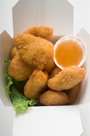 simsearch:659-01847943,k - Chicken Nuggets with sweet and sour sauce to take away Stock Photo - Premium Royalty-Free, Code: 659-01847436