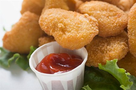 simsearch:659-01847449,k - Chicken Nuggets with ketchup Stock Photo - Premium Royalty-Free, Code: 659-01847441