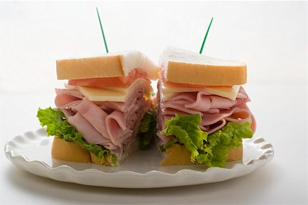 sandwich toast - Ham, cheese and tomato sandwich (halved) Stock Photo - Premium Royalty-Free, Code: 659-01847745