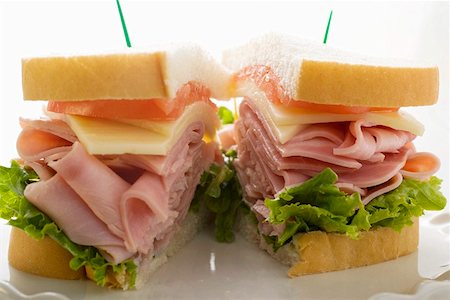 sandwich toast - Ham, cheese and tomato sandwich (halved) Stock Photo - Premium Royalty-Free, Code: 659-01847747