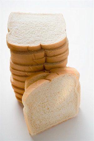 sliced bread - White sliced bread, in a pile Foto de stock - Sin royalties Premium, Código: 659-01847740