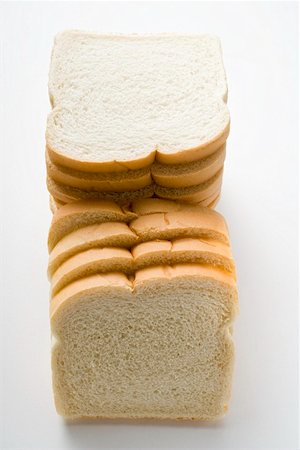 sliced bread - White sliced bread, in a pile Foto de stock - Sin royalties Premium, Código: 659-01847741