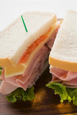 sandwich toast - Ham, cheese and tomato sandwich (halved) Stock Photo - Premium Royalty-Free, Code: 659-01847750