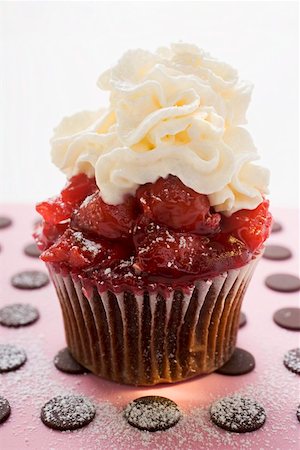 Chocolate cherry muffin with whipped cream Stock Photo - Premium Royalty-Free, Code: 659-01847818