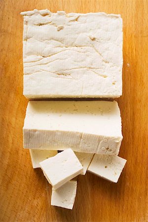 Tofu, a block, a slice and diced on wooden background Stock Photo - Premium Royalty-Free, Code: 659-01847871