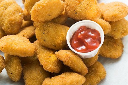 Chicken nuggets with ketchup Stock Photo - Premium Royalty-Free, Code: 659-01847932