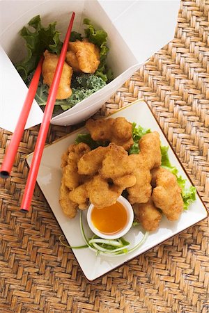 Asian chicken nuggets with apricot sauce to take away Stock Photo - Premium Royalty-Free, Code: 659-01847950