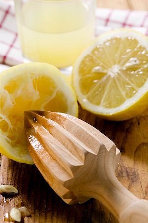 simsearch:659-01846643,k - Lemons with wooden squeezer and lemon juice Stock Photo - Premium Royalty-Free, Code: 659-01848062