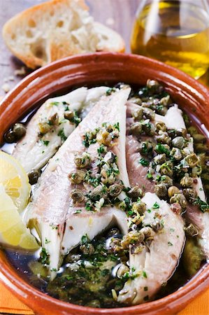 fish with olive oil - Fish fillets in olive oil with capers Stock Photo - Premium Royalty-Free, Code: 659-01848080