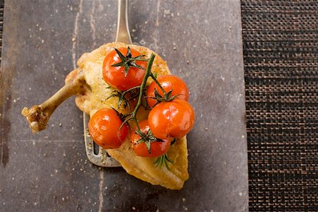 simsearch:659-03528079,k - Fried chicken breast with cherry tomatoes on spatula Stock Photo - Premium Royalty-Free, Code: 659-01848215